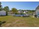 Spacious backyard features an above-ground pool, privacy fence, storage building, and mature landscaping at 2703 Canvasback Trail, Myrtle Beach, SC 29588