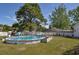 Backyard with an above-ground pool, ladder, and a well-maintained grassy area at 2703 Canvasback Trail, Myrtle Beach, SC 29588