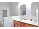 Bathroom featuring dual sinks with wood cabinets and neutral wall colors at 2703 Canvasback Trail, Myrtle Beach, SC 29588