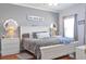 Cozy bedroom featuring a white bed frame with gray walls and two matching bedside tables at 2703 Canvasback Trail, Myrtle Beach, SC 29588