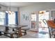 Bright dining area with a wooden table set with benches and a view of the outdoors at 2703 Canvasback Trail, Myrtle Beach, SC 29588
