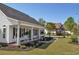 Charming single-story home with a welcoming front porch, mature trees, and well-manicured landscaping at 2703 Canvasback Trail, Myrtle Beach, SC 29588
