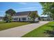 Charming single-story home with a welcoming front porch, long driveway, and mature landscaping at 2703 Canvasback Trail, Myrtle Beach, SC 29588