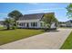 Charming single-story home with a well-manicured lawn and long driveway at 2703 Canvasback Trail, Myrtle Beach, SC 29588