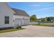 Spacious two-car garage with white doors, ample driveway space, and well-maintained landscaping at 2703 Canvasback Trail, Myrtle Beach, SC 29588