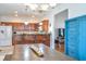 Open kitchen design with ample counter space, wooden cabinets, and barstool seating at 2703 Canvasback Trail, Myrtle Beach, SC 29588