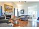 Bright living room featuring vaulted ceilings, hardwood floors, and a cozy fireplace at 2703 Canvasback Trail, Myrtle Beach, SC 29588