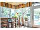 Inviting sunroom with wood accents, large windows offering pool views, and unique decor at 2703 Canvasback Trail, Myrtle Beach, SC 29588