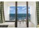 Oceanfront balcony with chairs and table offering stunning views of the blue sea at 3000 N Ocean Blvd. # 1020, Myrtle Beach, SC 29577