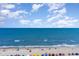 Expansive beachfront view featuring vibrant beach umbrellas, soft sand, and crystal-clear water under a sunny sky at 3000 N Ocean Blvd. # 1020, Myrtle Beach, SC 29577