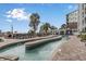Relaxing lazy river lined with lounge chairs and lush landscaping at this beachfront resort at 3000 N Ocean Blvd. # 1020, Myrtle Beach, SC 29577