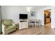 Neat living room with a TV, table with chairs and a kitchenette view at 3000 N Ocean Blvd. # 1020, Myrtle Beach, SC 29577