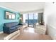 Cozy living room area featuring a sleeper sofa and a balcony with ocean views at 3000 N Ocean Blvd. # 1020, Myrtle Beach, SC 29577