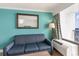 Relaxing living room area featuring comfortable seating and an AC unit near a window at 3000 N Ocean Blvd. # 1020, Myrtle Beach, SC 29577