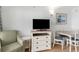 Bright living room area with a TV and chairs, and dining table at 3000 N Ocean Blvd. # 1020, Myrtle Beach, SC 29577