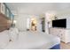View of bedroom space featuring white walls, wood flooring, and kitchenette view at 3000 N Ocean Blvd. # 1020, Myrtle Beach, SC 29577