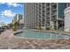Spacious swimming pool with lounge chairs and a clear view of the high-rise balconies at this resort at 3000 N Ocean Blvd. # 1020, Myrtle Beach, SC 29577