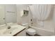 Clean bathroom featuring a vanity sink, toilet, and shower with white curtain at 3170 Holmestown Rd., Myrtle Beach, SC 29588