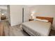 Comfortable bedroom features hardwood floors, a queen-sized bed, and warm lighting at 3170 Holmestown Rd., Myrtle Beach, SC 29588