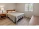 Cozy bedroom with hardwood floors, complemented by a wooden dresser and nightstand at 3170 Holmestown Rd., Myrtle Beach, SC 29588