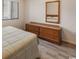 Bright bedroom with hardwood floors, a wooden dresser, and window at 3170 Holmestown Rd., Myrtle Beach, SC 29588