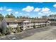 Well-maintained condo complex boasting red doors, charming balconies, and meticulously manicured landscaping at 3170 Holmestown Rd., Myrtle Beach, SC 29588