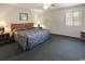 The main bedroom has a big window, a ceiling fan, and two end tables at 3170 Holmestown Rd., Myrtle Beach, SC 29588