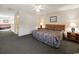 A bedroom featuring a plush bed, ceiling fan, two bedside tables, and ample space at 3170 Holmestown Rd., Myrtle Beach, SC 29588