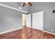 This is a bedroom with hardwood floors, a ceiling fan and a closet at 3700 Golf Colony Lane # 5J, Little River, SC 29566