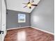 This bedroom includes hardwood floors, ceiling fan, baseboard and a window at 3700 Golf Colony Lane # 5J, Little River, SC 29566