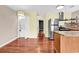 Efficient kitchen includes stainless appliances, wood cabinets, granite countertops, and laundry closet at 3700 Golf Colony Lane # 5J, Little River, SC 29566
