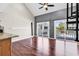 Bright living room with hardwood floors and sliding doors to a patio at 3700 Golf Colony Lane # 5J, Little River, SC 29566