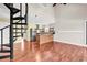Open-concept living area featuring a spiral staircase and a modern kitchen at 3700 Golf Colony Lane # 5J, Little River, SC 29566