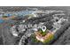 Overhead shot of a condo complex with a red roof, amidst trees, with a partial grayscale background at 4601 Greenbriar Dr. # 201, Little River, SC 29566