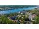 Aerial view showcasing the property's proximity to a river, boat docks, and a lighthouse at 4601 Greenbriar Dr. # 201, Little River, SC 29566
