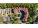 An aerial view of a well-maintained condominium building, showcasing its location and surroundings at 4601 Greenbriar Dr. # 201, Little River, SC 29566