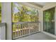 Balcony view with white railings showcasing the trees for a private outdoor escape at 4601 Greenbriar Dr. # 201, Little River, SC 29566