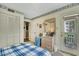 Bedroom with closet, dresser, decor, and door to the balcony at 4601 Greenbriar Dr. # 201, Little River, SC 29566