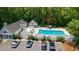 Aerial view of a community pool, lounge area, and parking for residents and guests at 4601 Greenbriar Dr. # 201, Little River, SC 29566