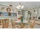 Dining room with round glass table and seating for four; adjacent to the kitchen at 4601 Greenbriar Dr. # 201, Little River, SC 29566