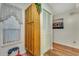 Hallway featuring a window, closet, and wooden cabinets for storage space at 4601 Greenbriar Dr. # 201, Little River, SC 29566