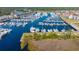 Aerial view of a marina filled with boats docked in slips on a sunny day at 4601 Greenbriar Dr. # 201, Little River, SC 29566
