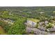 Scenic aerial view of a golf course community with lush greenery, lake, and beautifully designed homes at 4648 Fringetree Dr. # C, Murrells Inlet, SC 29576