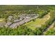 Aerial view of the community with lush landscaping, golf course, lake, swimming pool and beautifully designed homes at 4648 Fringetree Dr. # C, Murrells Inlet, SC 29576