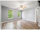 Bedroom with wood floors, a ceiling fan, and windows providing natural light at 4648 Fringetree Dr. # C, Murrells Inlet, SC 29576