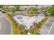 Aerial view of a large community pool surrounded by palm trees, landscaping, and lounge areas at 4648 Fringetree Dr. # C, Murrells Inlet, SC 29576