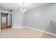 The dining room features neutral walls, tile flooring and a decorative light fixture at 4648 Fringetree Dr. # C, Murrells Inlet, SC 29576