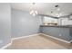 Bright dining room with neutral walls, tile flooring, and a view of the kitchen at 4648 Fringetree Dr. # C, Murrells Inlet, SC 29576