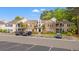 Exterior shot of a brick condo featuring a parking lot and partial views of the building at 4648 Fringetree Dr. # C, Murrells Inlet, SC 29576