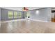 Bright, open living space with tiled floors, many windows and a view to the outdoor patio at 4648 Fringetree Dr. # C, Murrells Inlet, SC 29576